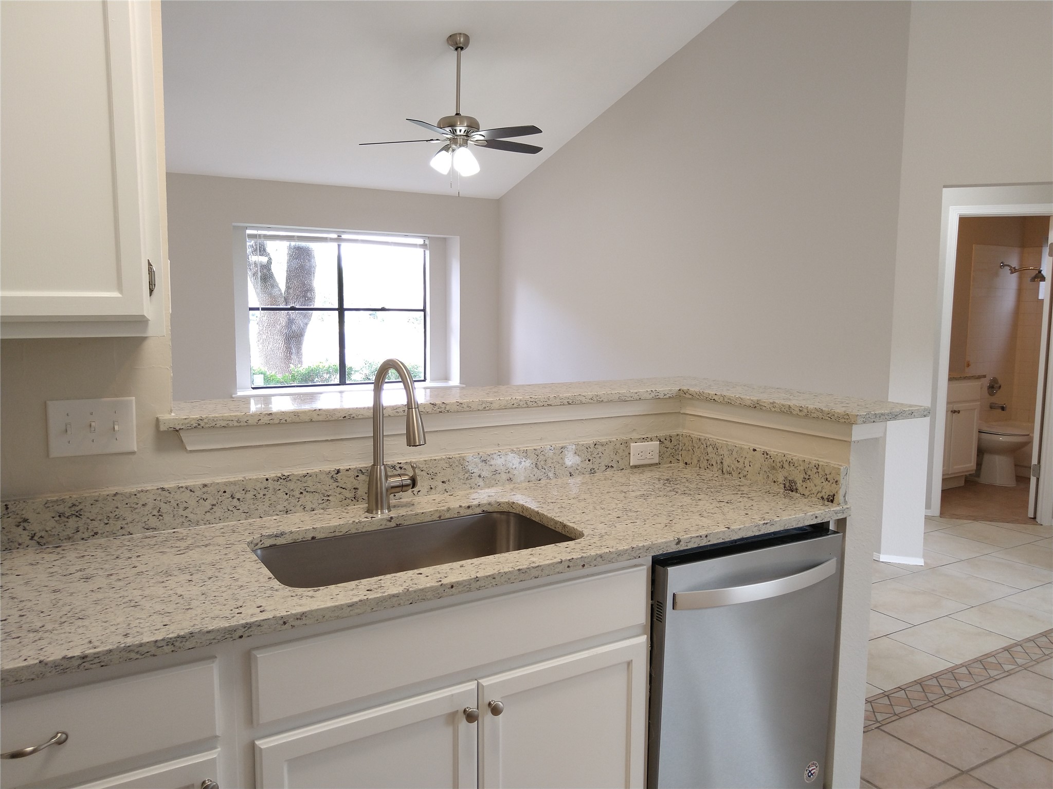 1813 Laurel Path Round Rock, TX 78664 - Photo 15 of 35 Granite counters and stainless steel appliances complete this well-appointed kitchen, flowing into an inviting living space.
