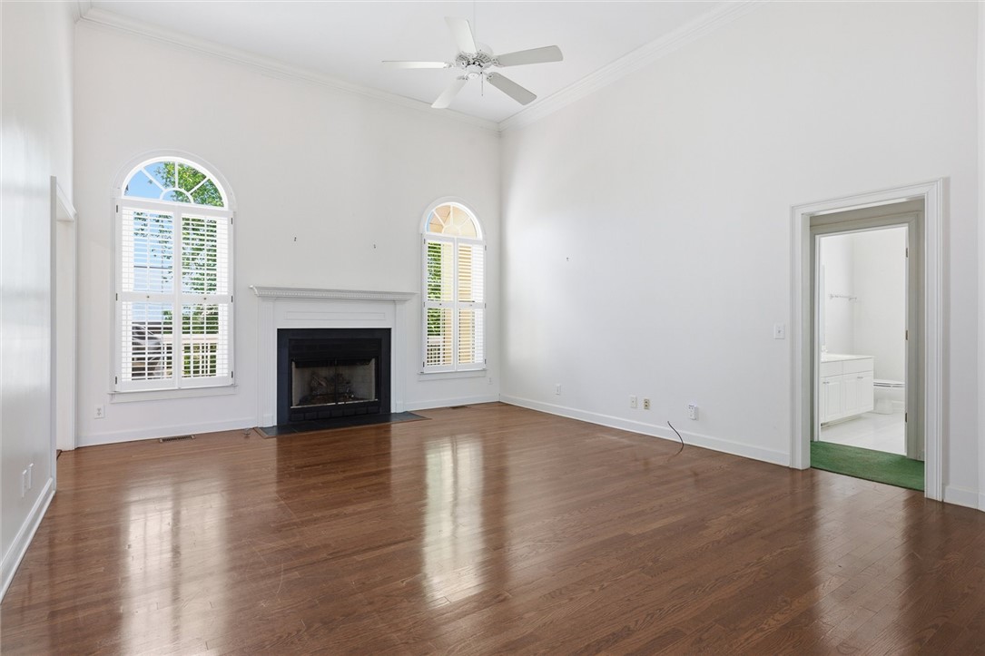 110 Garden Gate Drive Anderson, SC 29621 - Photo 12 of 35 This expansive room offers polished hardwood floors and an inviting fireplace, perfect for relaxation.