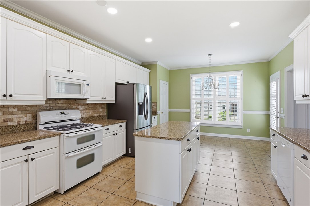 110 Garden Gate Drive Anderson, SC 29621 - Photo 16 of 35 This bright kitchen features ample cabinetry and a functional island, perfect for everyday living.