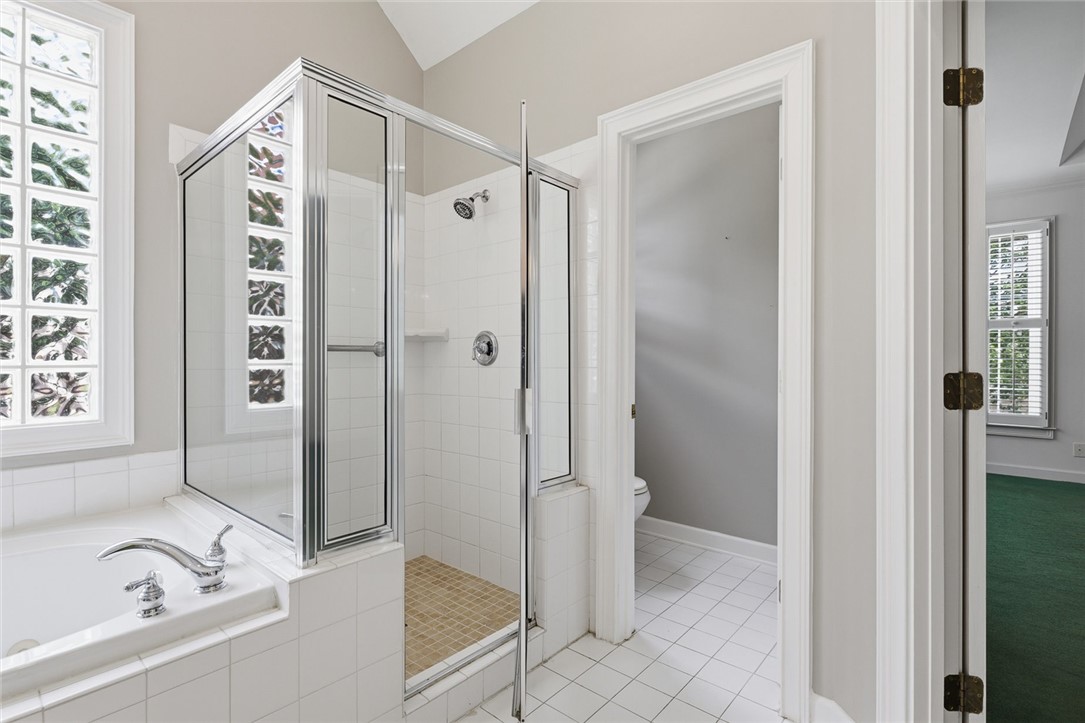 110 Garden Gate Drive Anderson, SC 29621 - Photo 21 of 35 This bathroom features a soaking tub, a separate shower, and tile flooring.