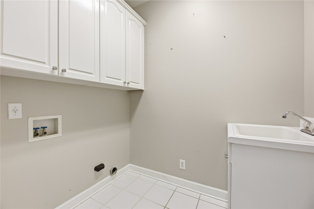 110 Garden Gate Drive Anderson, SC 29621 - Photo 27 of 35 This functional laundry room features convenient upper cabinetry and a utility sink for all your needs.