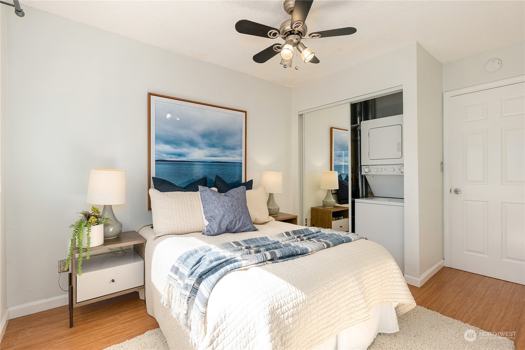 120 14th Avenue, Unit 10 Seattle, WA 98122 - Photo 16 of 21 a bedroom with a bed and a painting on the wall