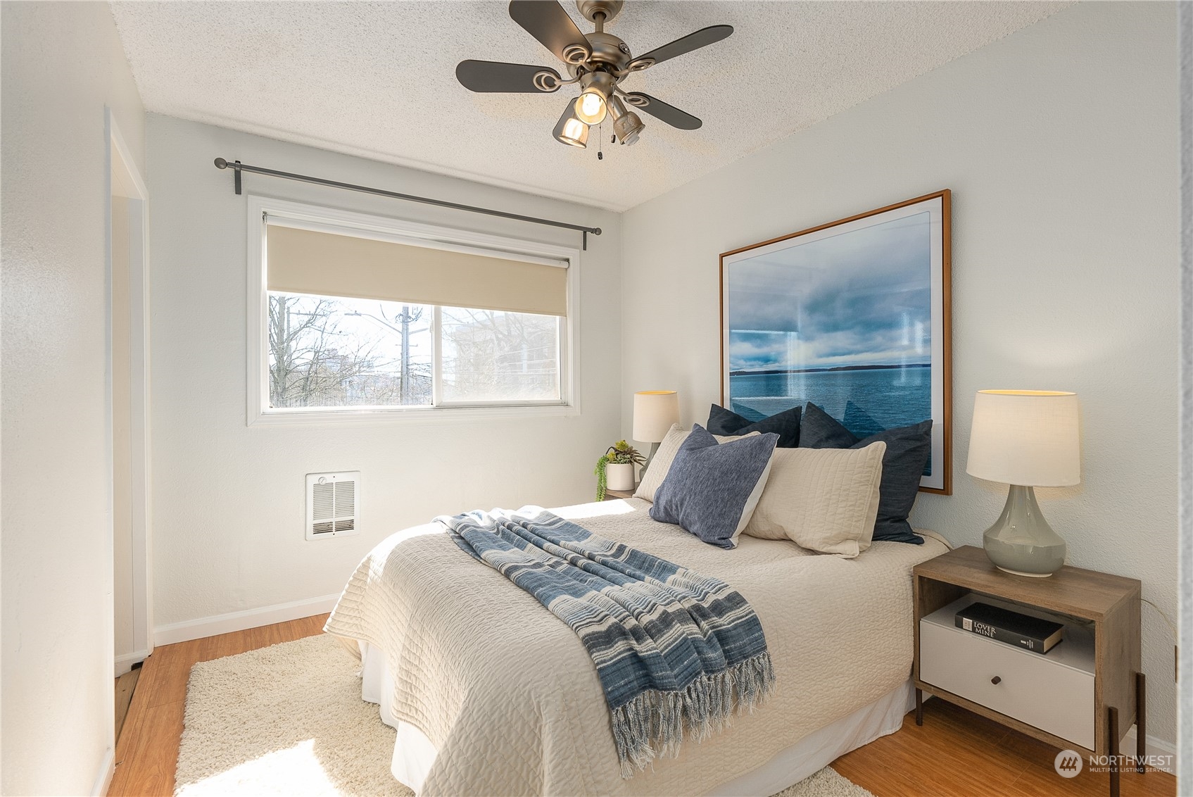 120 14th Avenue, Unit 10 Seattle, WA 98122 - Photo 17 of 21 a bedroom with a bed and a window