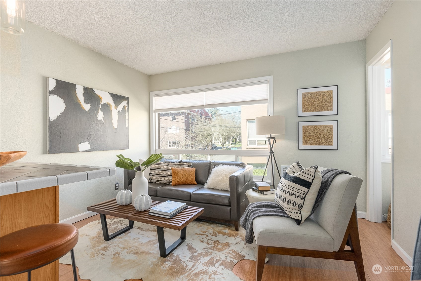 120 14th Avenue, Unit 10 Seattle, WA 98122 - Photo 8 of 21 a living room with furniture and a large window