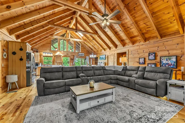 a living room with furniture and a rug