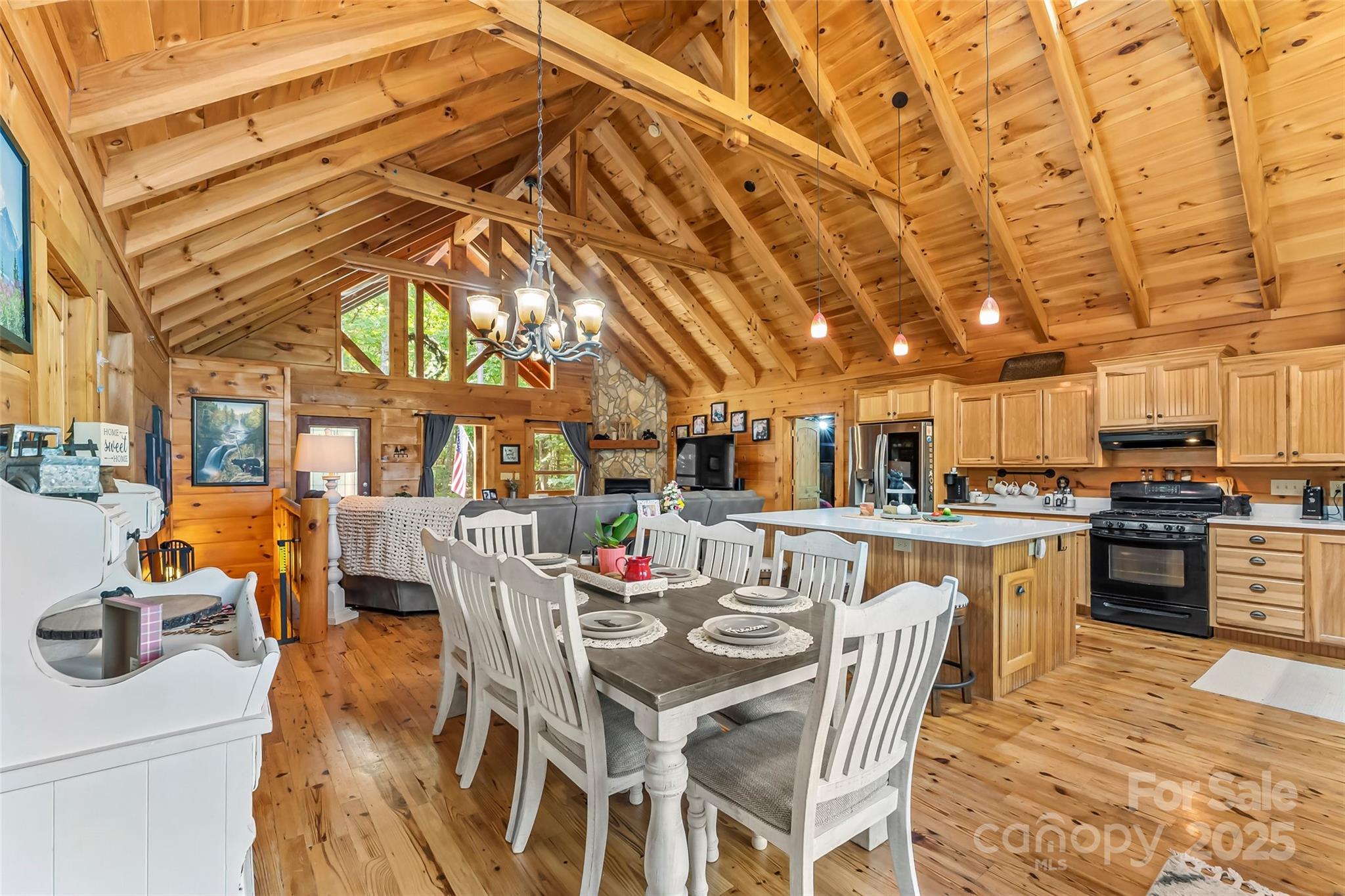 279 Outback Trail Nebo, NC 28761 - Photo 15 of 45 a view of a dining room with furniture and a kitchen
