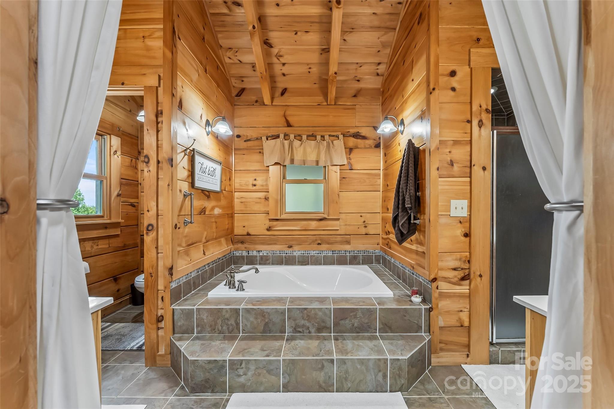 279 Outback Trail Nebo, NC 28761 - Photo 26 of 45 a bathroom with a tub and shower
