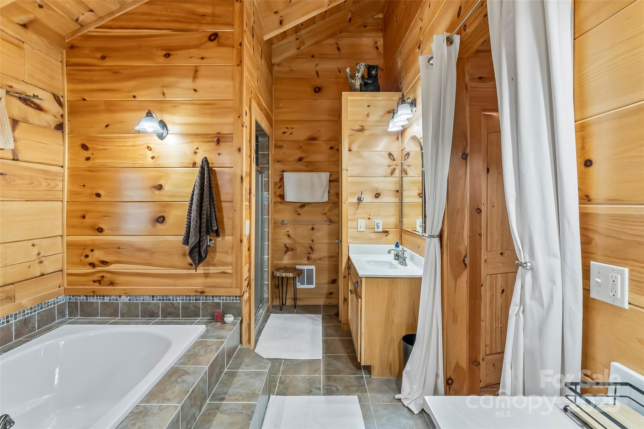 279 Outback Trail Nebo, NC 28761 - Photo 27 of 45 a bathroom with a bathtub and a shower