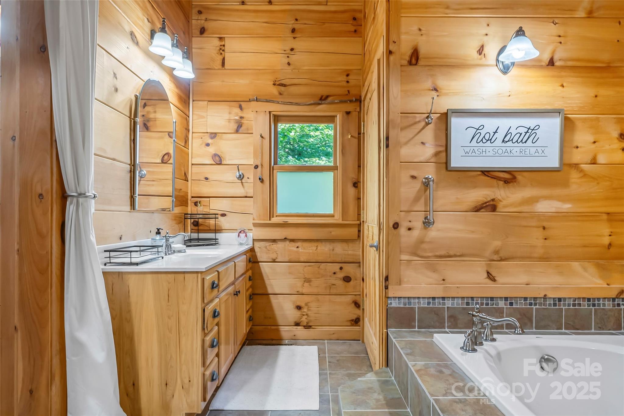 279 Outback Trail Nebo, NC 28761 - Photo 28 of 45 a bathroom with a tub sink and mirror