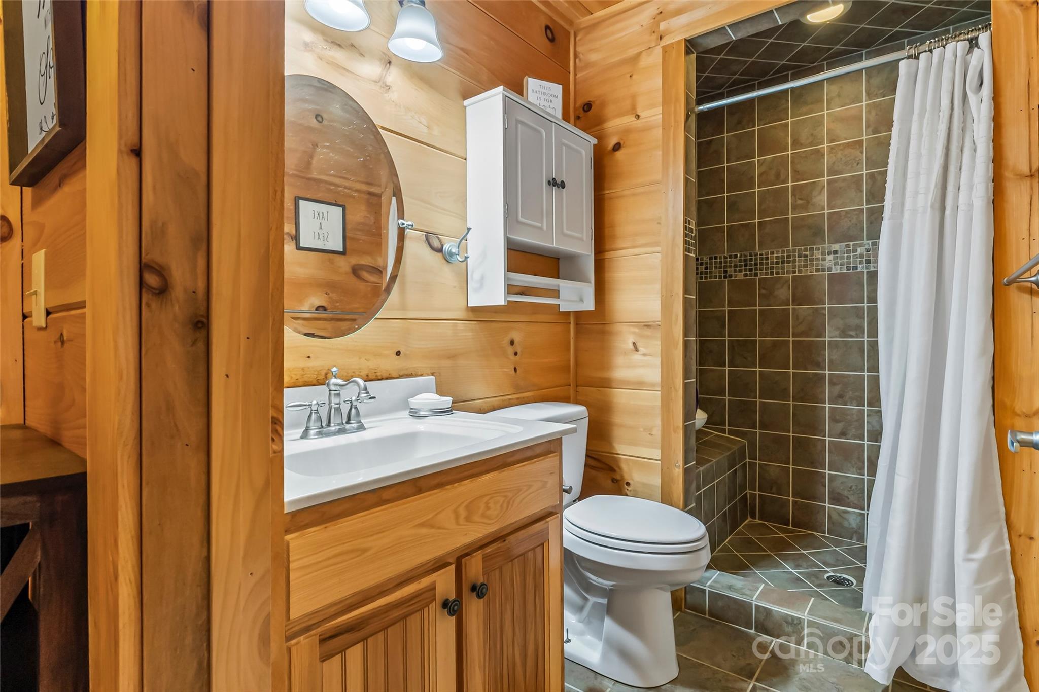 279 Outback Trail Nebo, NC 28761 - Photo 32 of 45 a bathroom with a sink toilet and shower