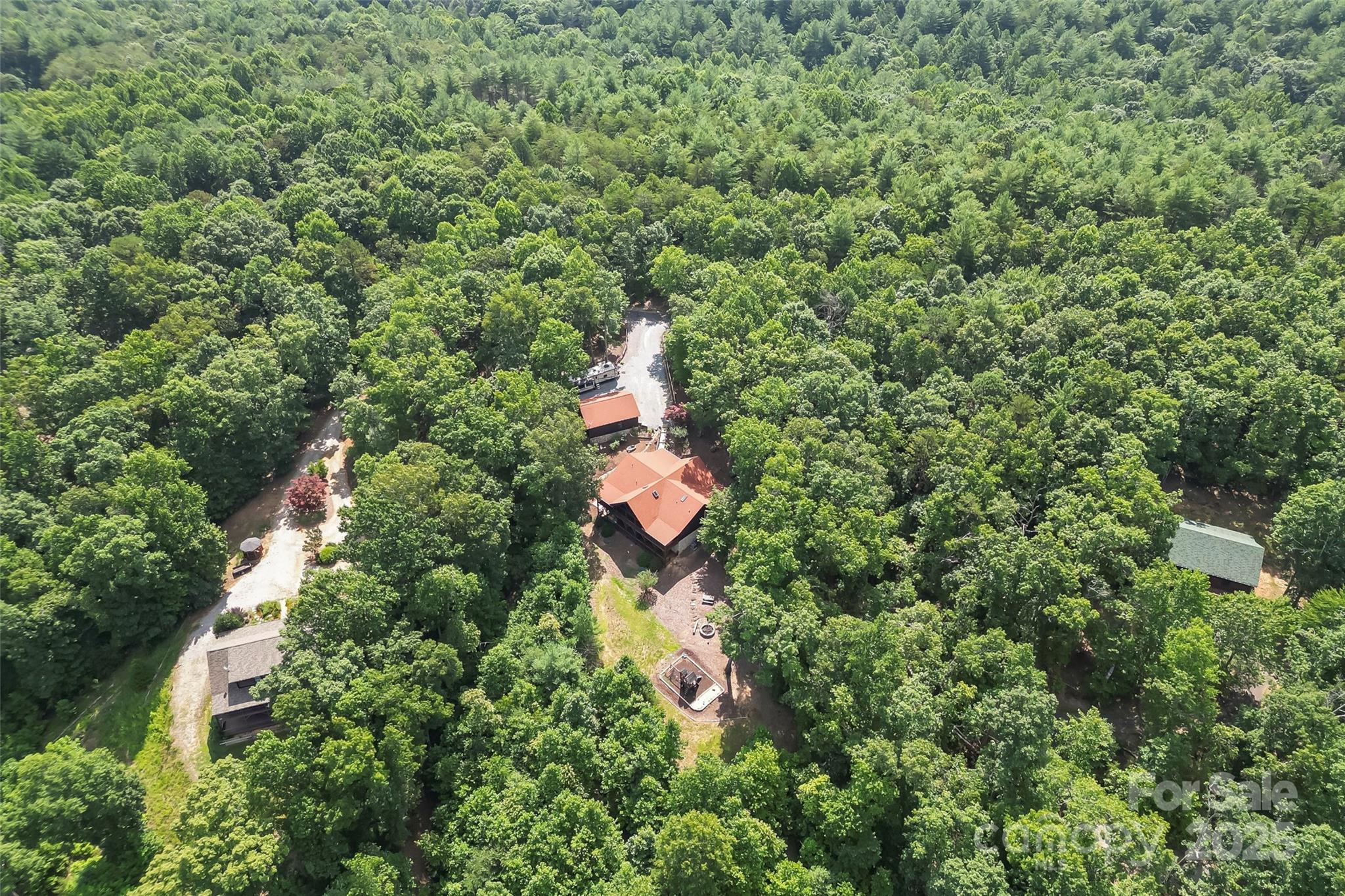 279 Outback Trail Nebo, NC 28761 - Photo 44 of 45 an aerial view of residential house with outdoor space and trees all around