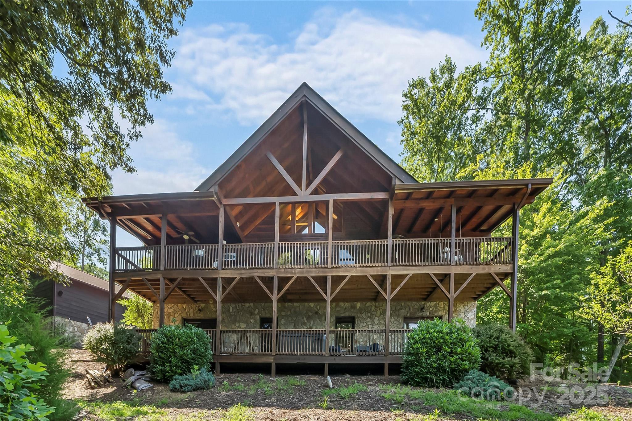 279 Outback Trail Nebo, NC 28761 - Photo 5 of 45 a view of a wooden chairs and table in the backyard