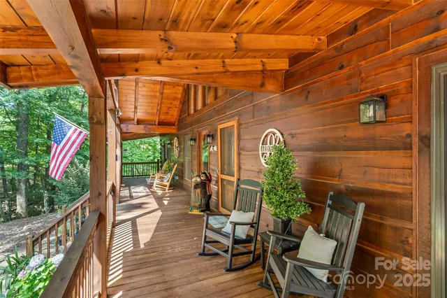 a view of a chairs and table in patio with wooden floor