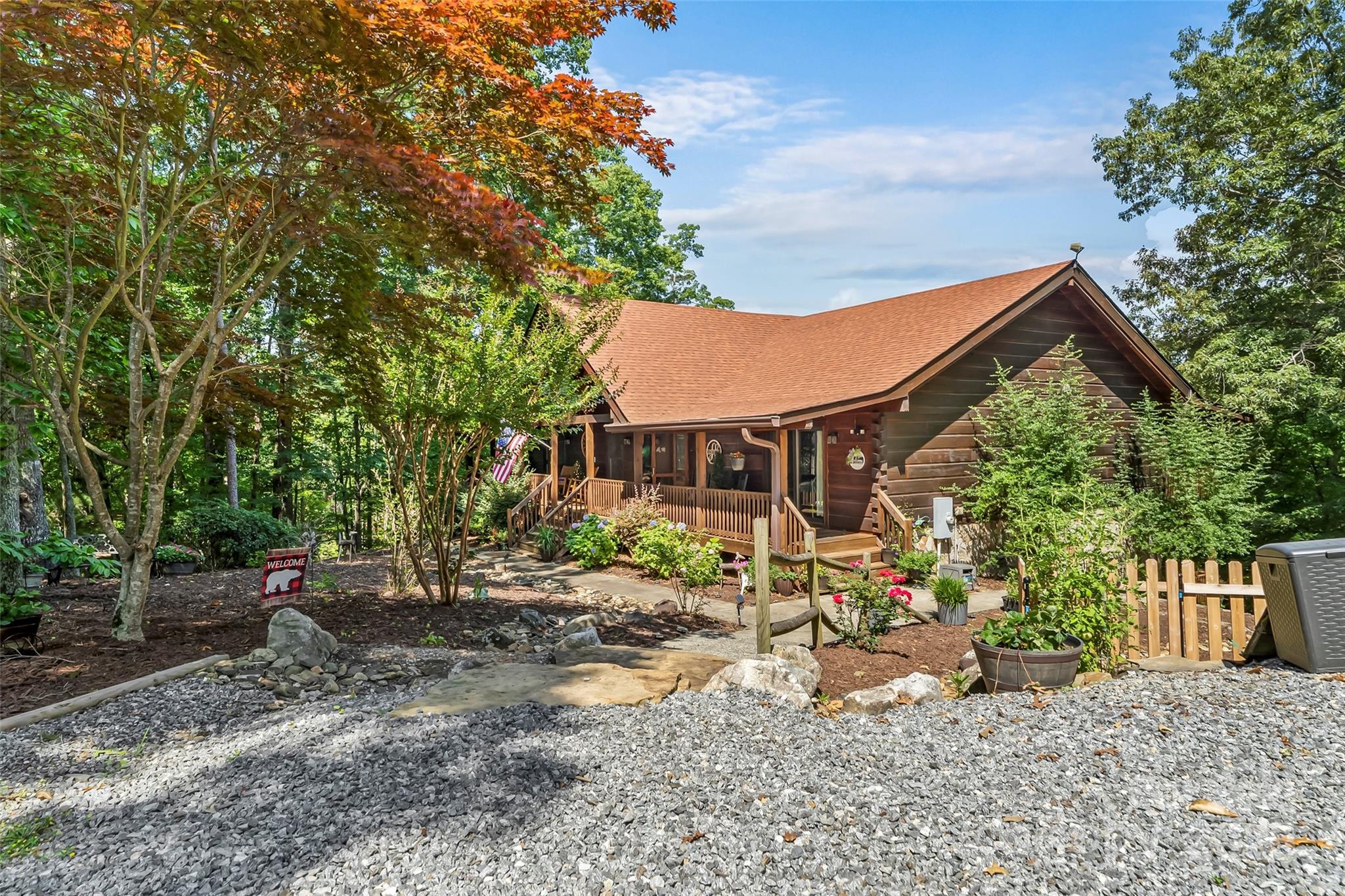 279 Outback Trail Nebo, NC 28761 - Photo 8 of 45 a front view of a house with a garden