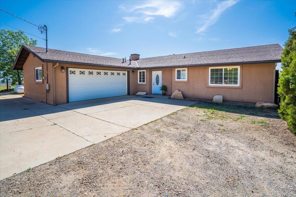 a house view with a backyard space