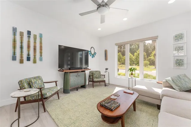a living room with furniture and a large window