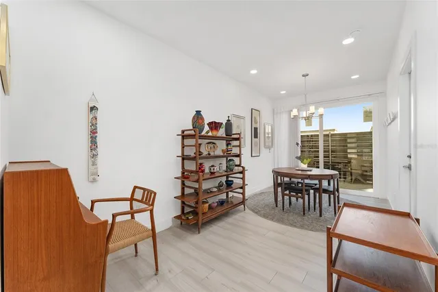 a dining room with furniture and window