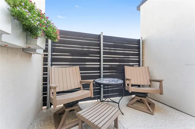 a white toilet sitting next to a shower