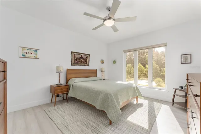 a bathroom with a sink vanity granite tub shower and a mirror