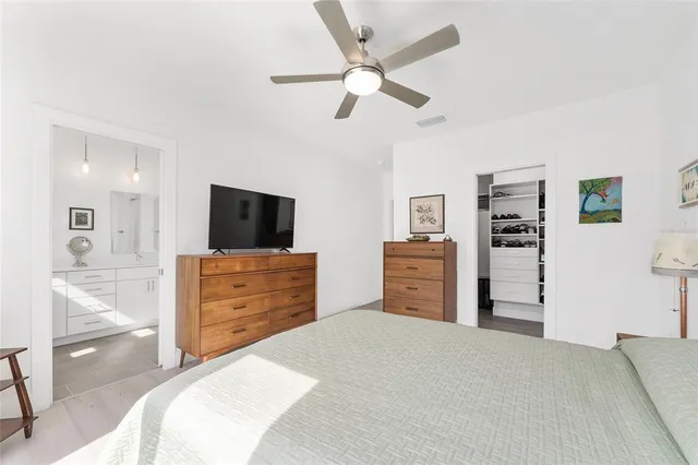 a bathroom with a double vanity sink mirror and shower