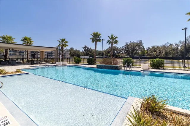 a open kitchen with stainless steel appliances granite countertop a sink dishwasher and a stove