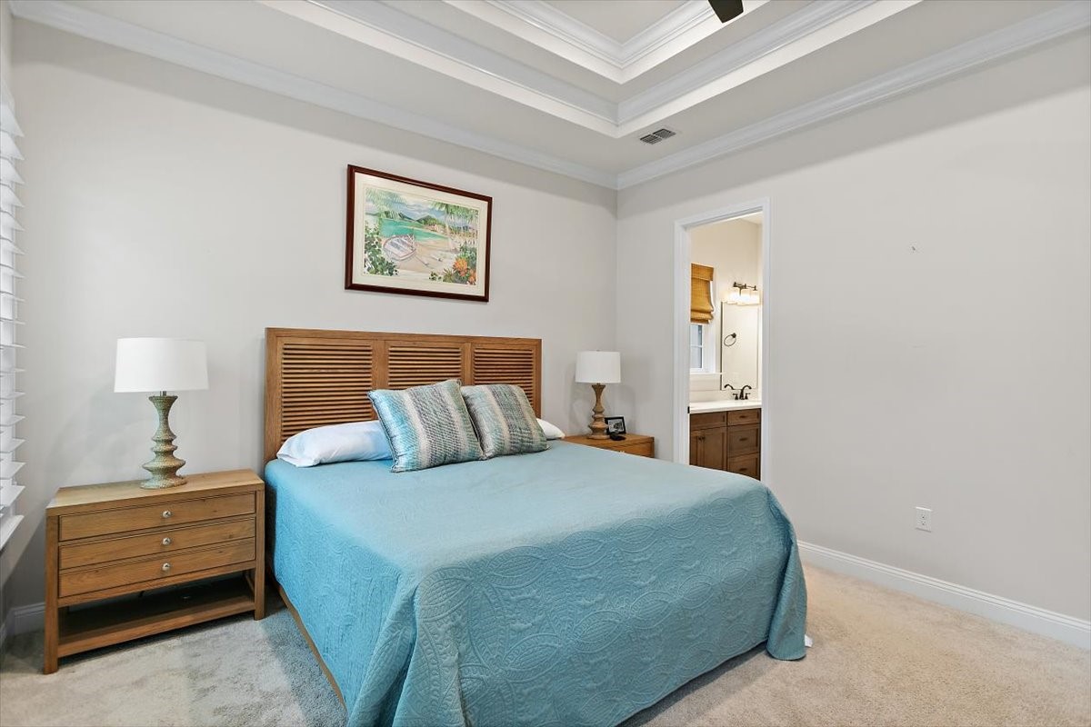 96014 Enclave Manor Fernandina Beach, FL 32034 - Photo 13 of 32 a bedroom with a bed and a lamp on dresser