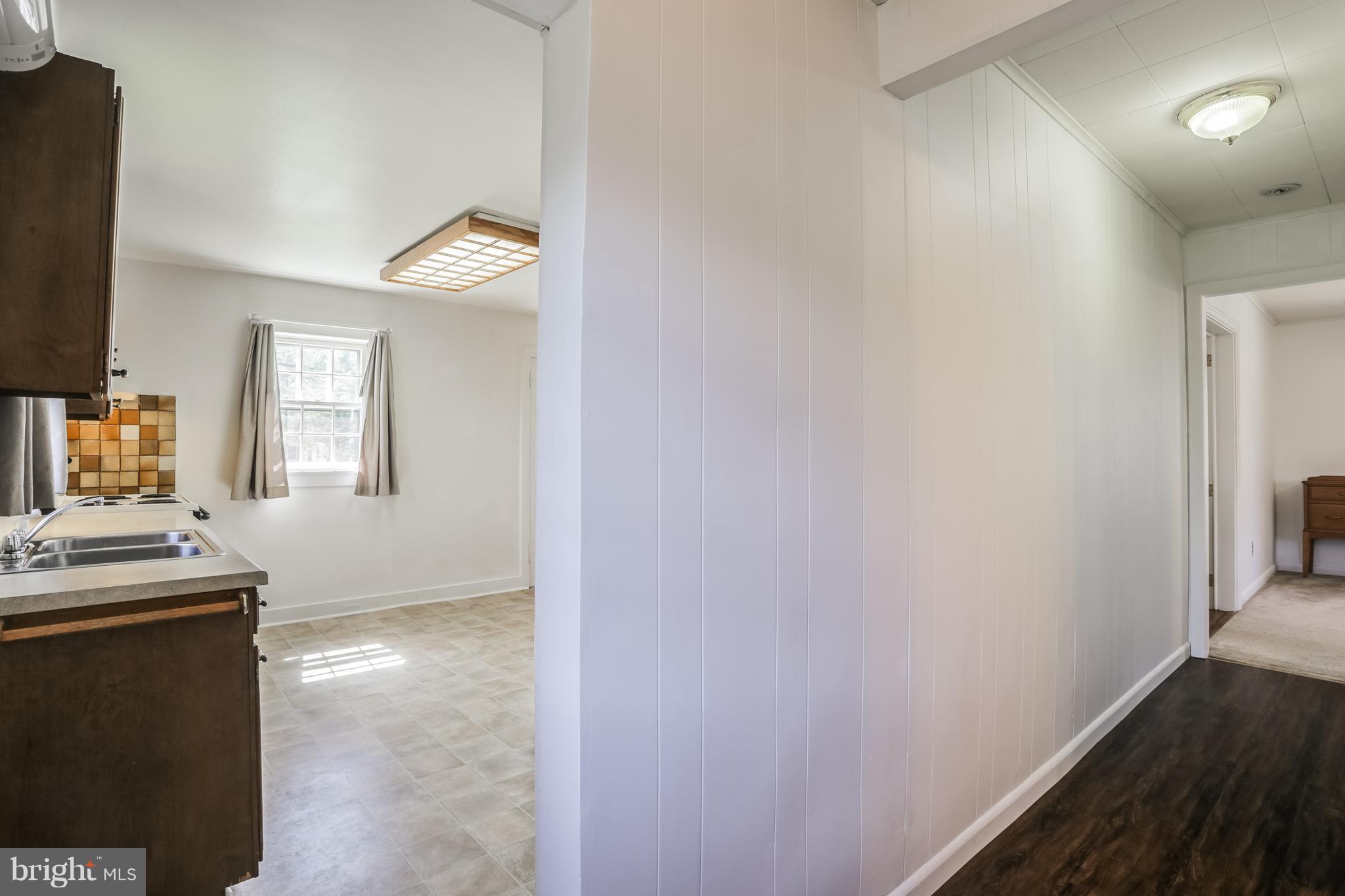 12182 Triadelphia Road Ellicott City, MD 21042 - Photo 27 of 30 Side entry door takes you to kitchen and hallway