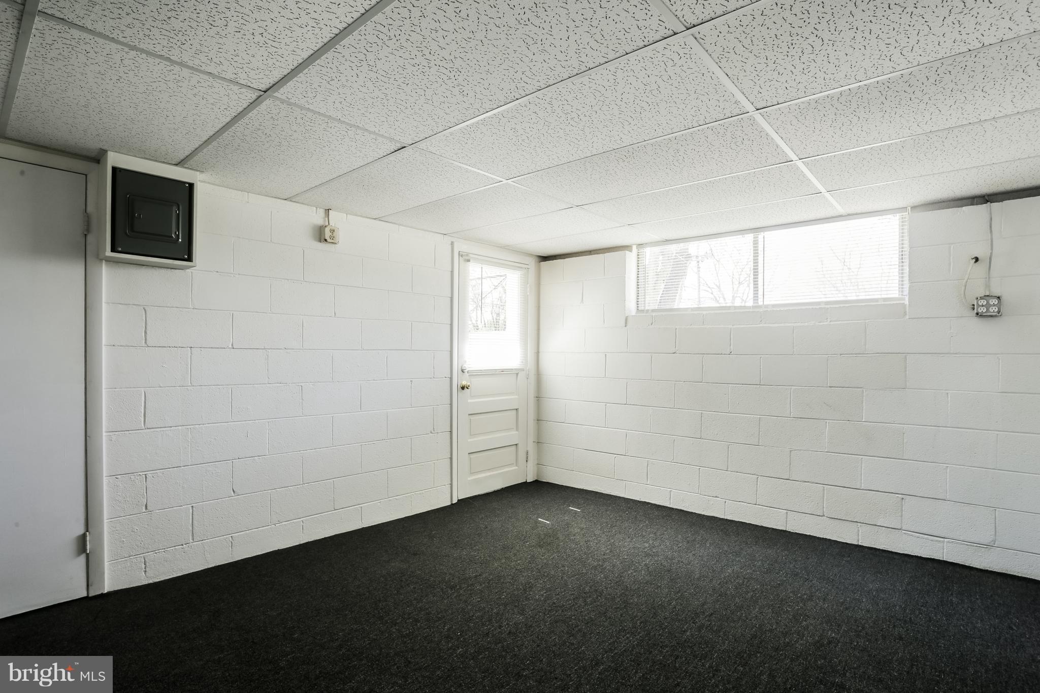 12182 Triadelphia Road Ellicott City, MD 21042 - Photo 28 of 30 Multipurpose room has door to walkout/up