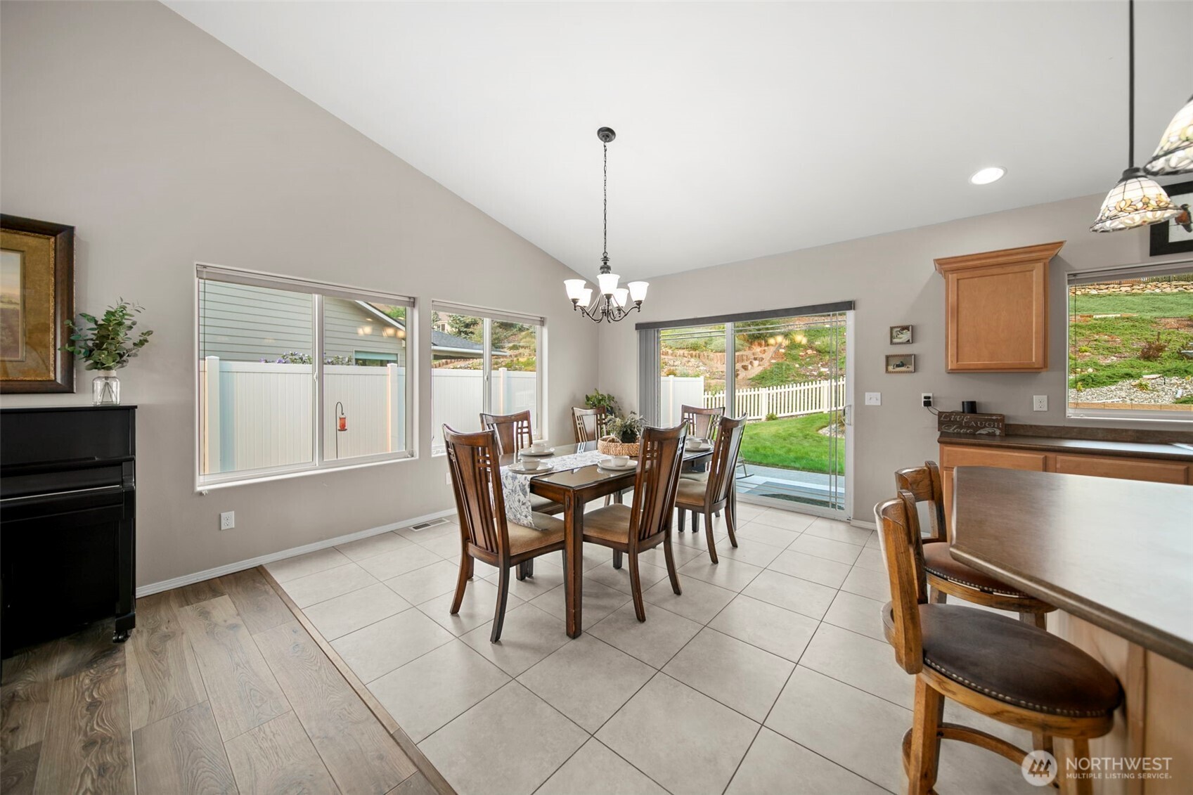 2012 Linville Drive Wenatchee, WA 98801 - Photo 12 of 40 a dining room with furniture a chandelier and wooden floor