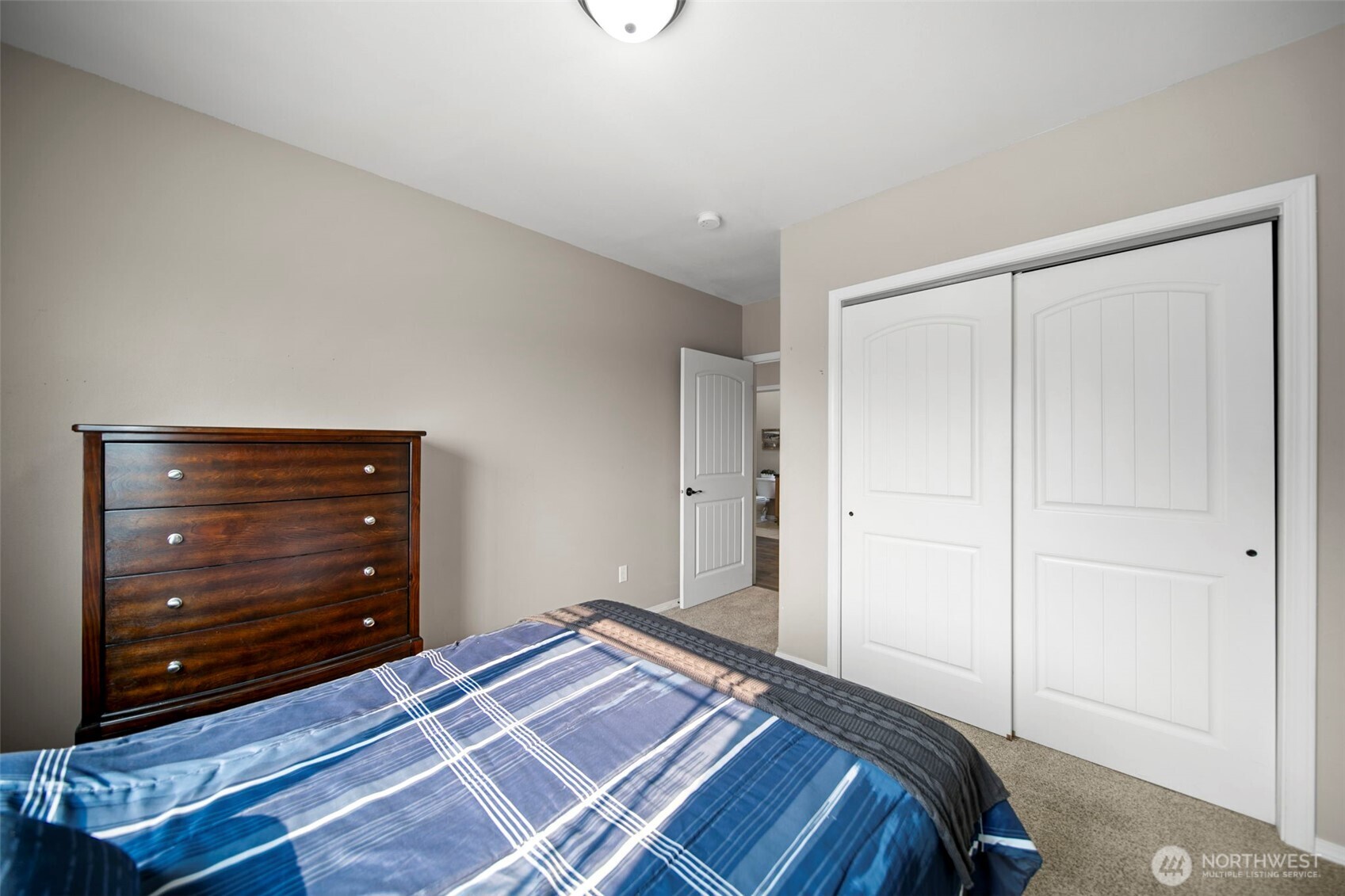 2012 Linville Drive Wenatchee, WA 98801 - Photo 19 of 40 a bedroom with a bed and a dresser