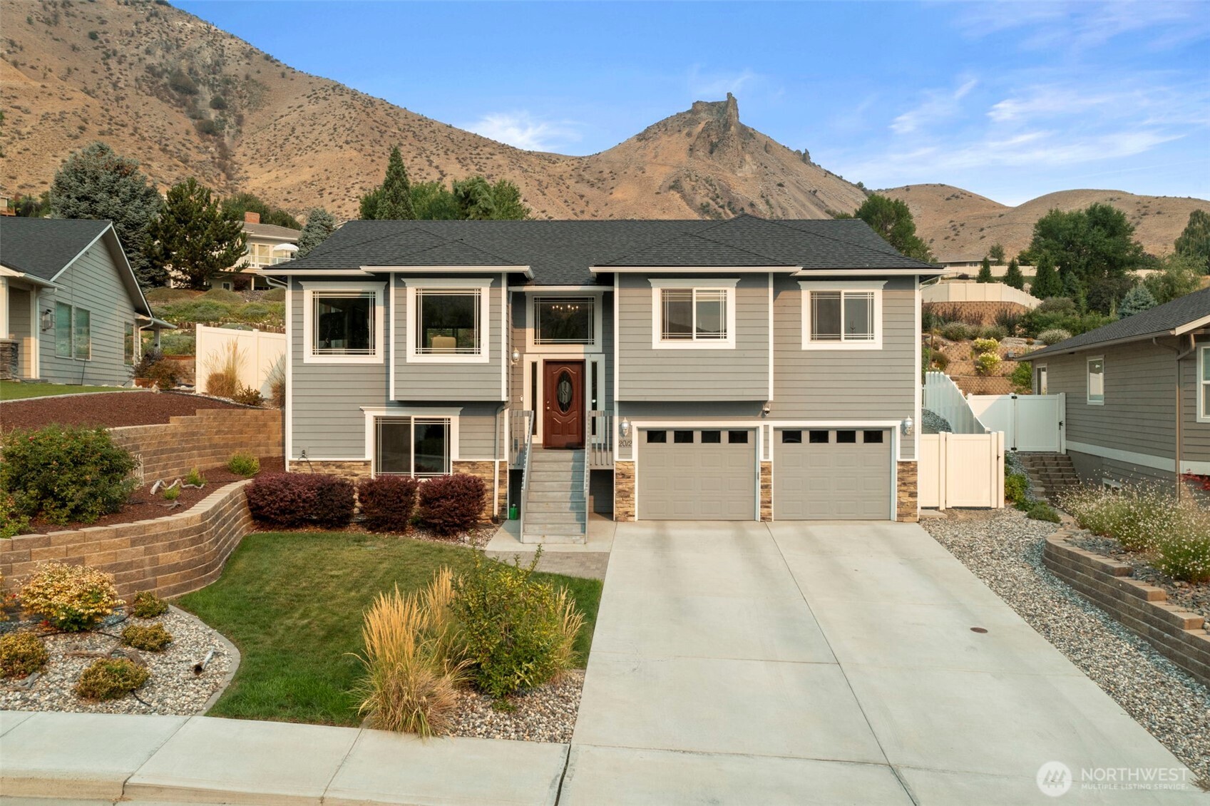 2012 Linville Drive Wenatchee, WA 98801 - Photo 2 of 40 front view of a house with a yard