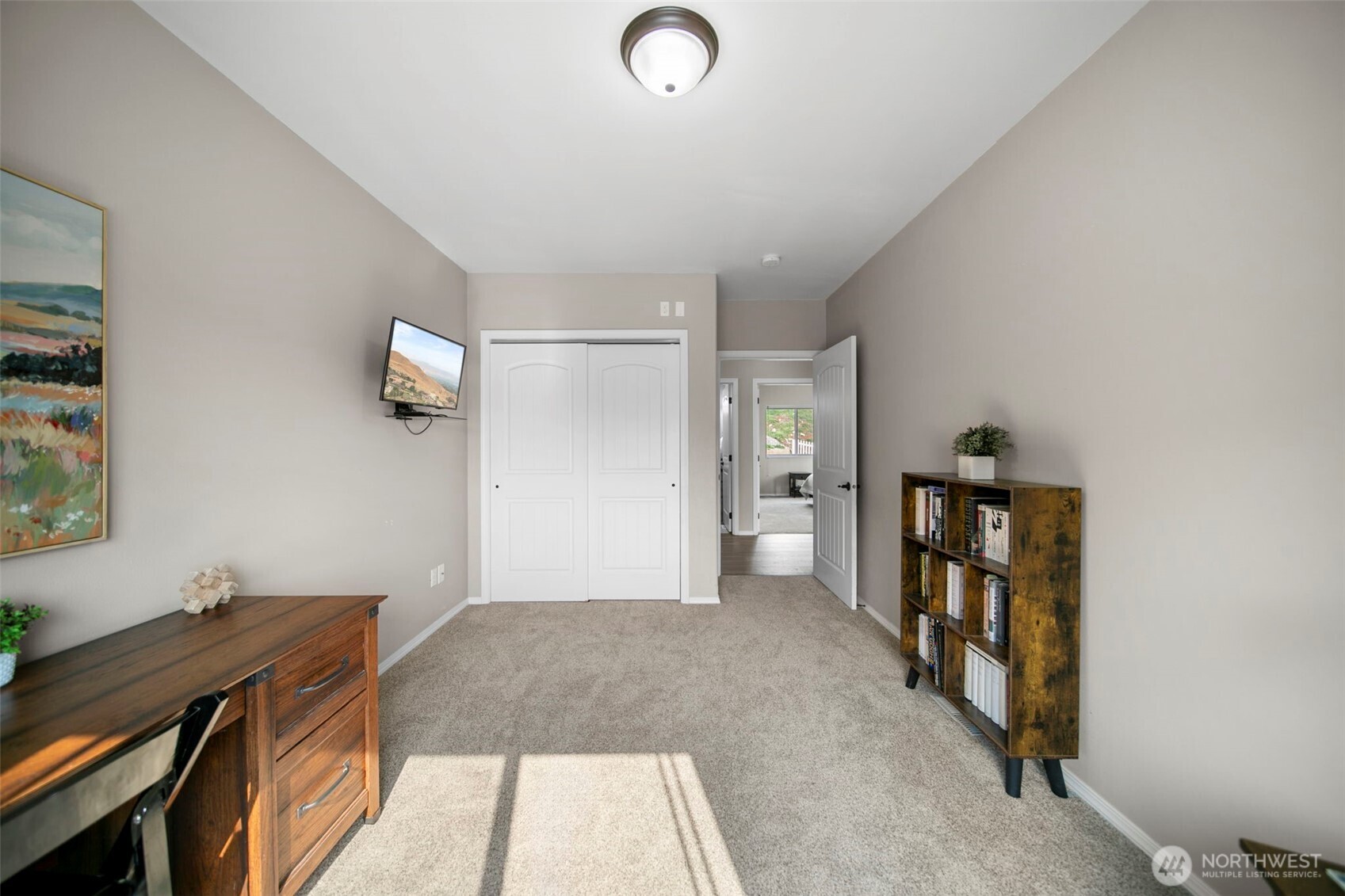 2012 Linville Drive Wenatchee, WA 98801 - Photo 21 of 40 a view of a livingroom with wooden floor and a workspace