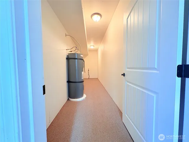 a roof deck with table and chairs and potted plants with sky view