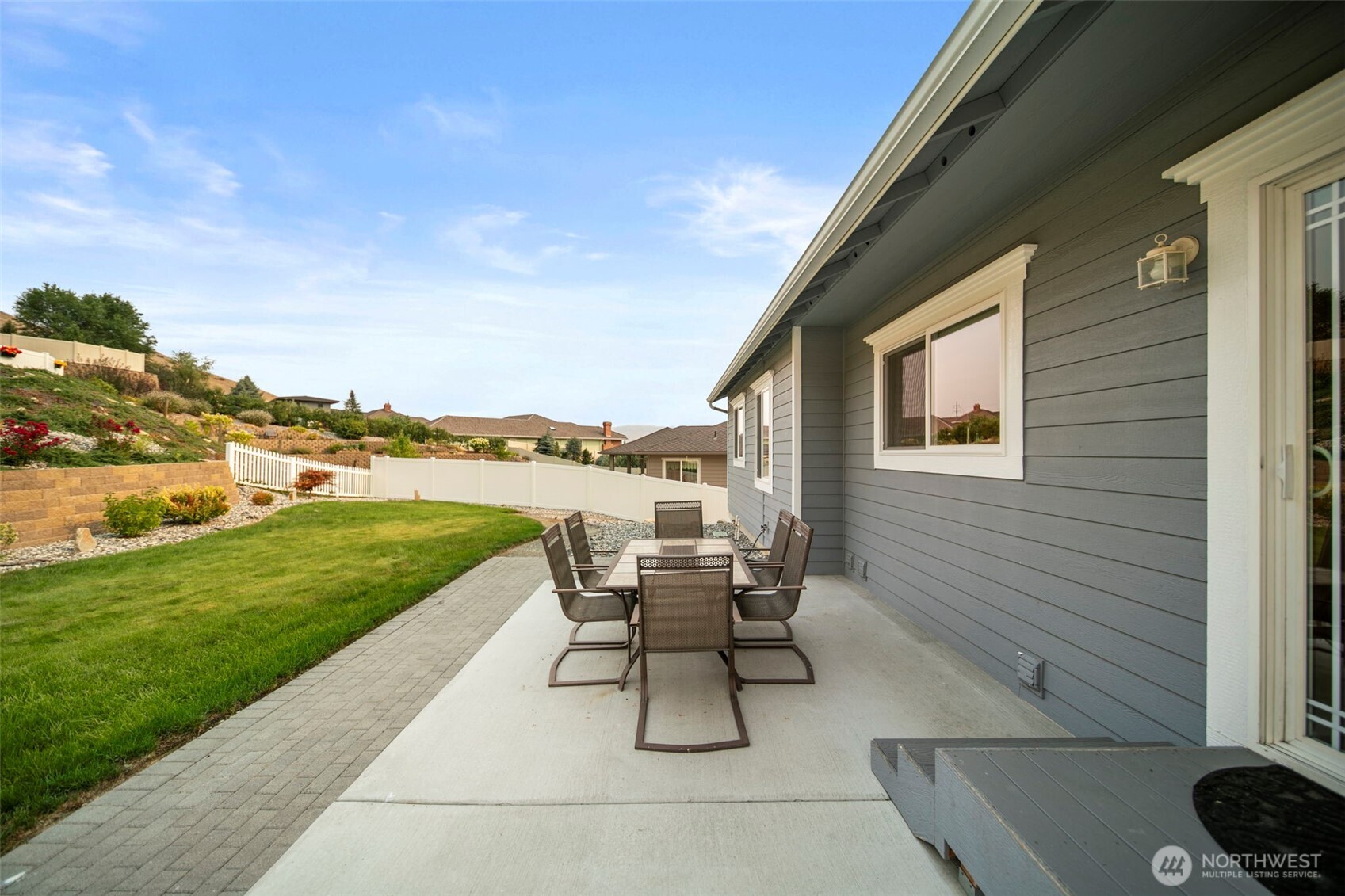 2012 Linville Drive Wenatchee, WA 98801 - Photo 30 of 40 a roof deck with table and chairs and potted plants with sky view