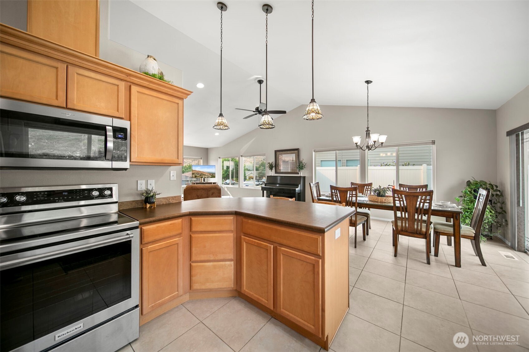 2012 Linville Drive Wenatchee, WA 98801 - Photo 10 of 40 a kitchen with stainless steel appliances granite countertop a stove a sink and a microwave