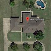 an aerial view of a wooden house