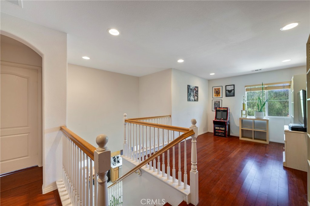 3819 St Austell Way Perris, CA 92571 - Photo 23 of 64 a view of room with wooden floor and windows