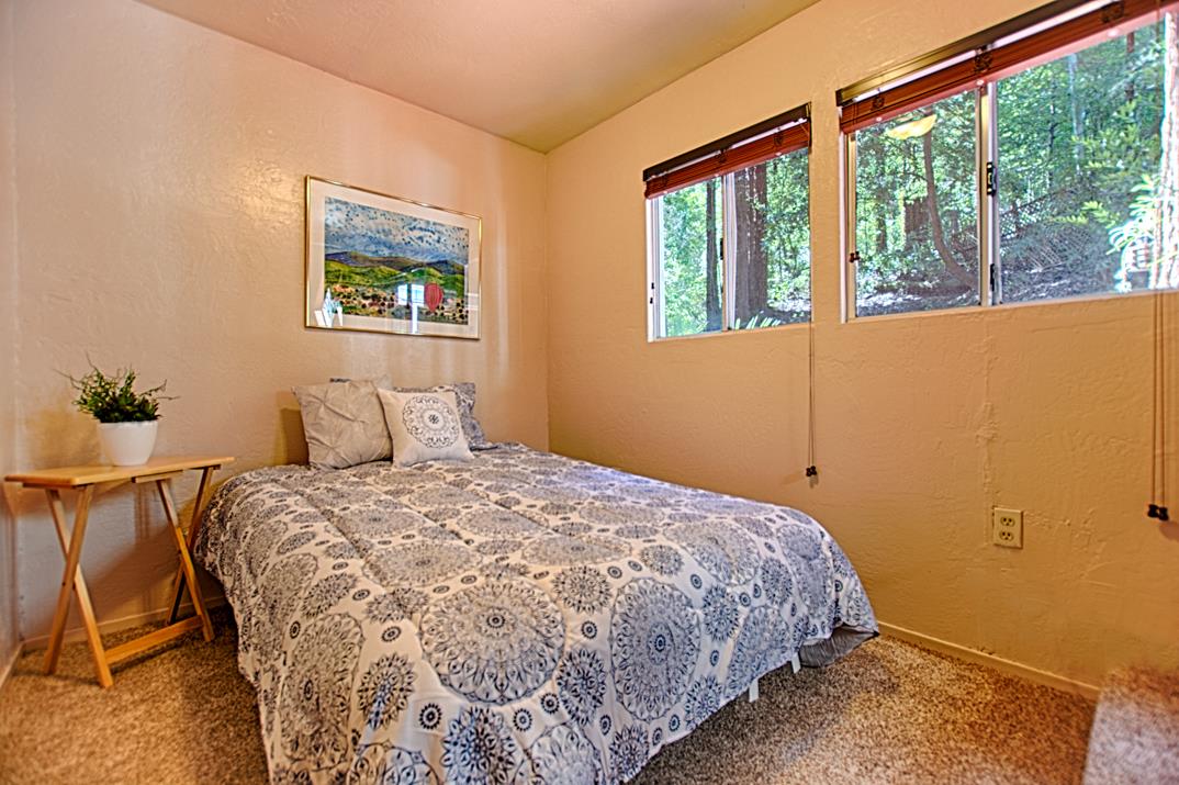 225 Glengarry Road Felton, CA 95018 - Photo 14 of 35 a bedroom with a bed and a window