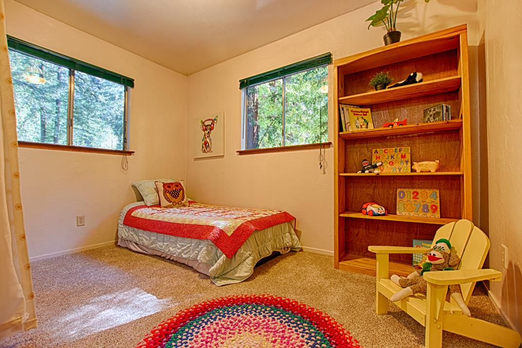225 Glengarry Road Felton, CA 95018 - Photo 16 of 35 a bedroom with a bed and a window