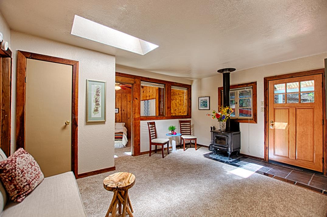 225 Glengarry Road Felton, CA 95018 - Photo 6 of 35 a living room with furniture a window and gym equipment