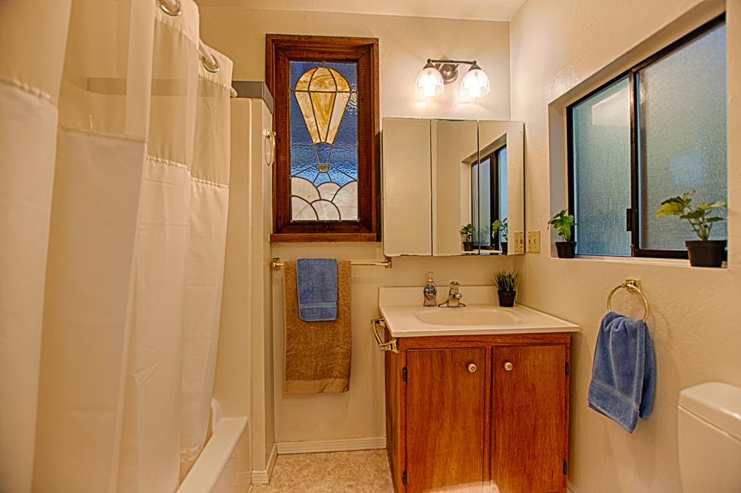 225 Glengarry Road Felton, CA 95018 - Photo 8 of 35 a bathroom with a sink and a mirror