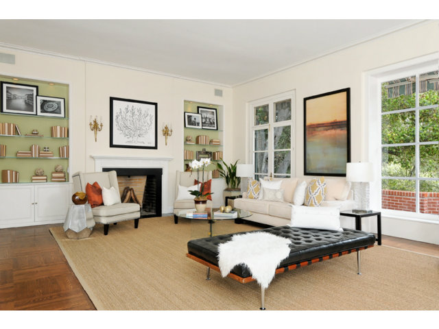 560 Moore Road Woodside, CA 94062 - Photo 13 of 17 a living room with furniture a fireplace and a flat screen tv