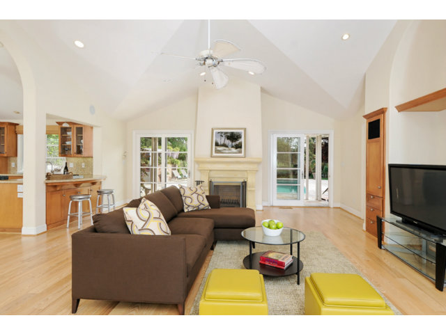 560 Moore Road Woodside, CA 94062 - Photo 17 of 17 a living room with furniture a fireplace and a flat screen tv