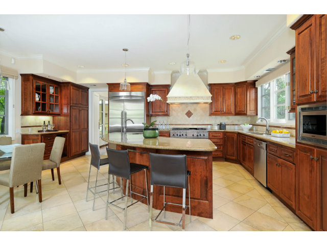 560 Moore Road Woodside, CA 94062 - Photo 4 of 17 a kitchen with stainless steel appliances a table chairs sink and cabinets