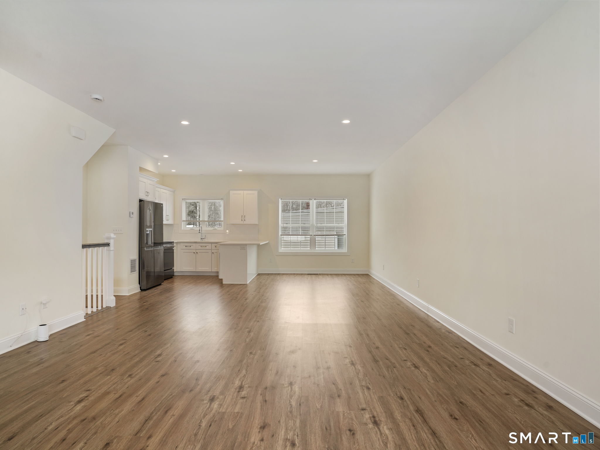 6 Beacon Square, Unit 7 Fairfield, CT 06825 - Photo 21 of 33 a view of a kitchen with wooden floor and a window