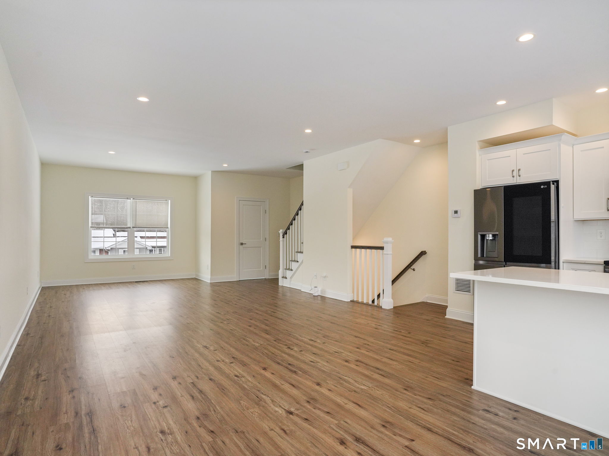 6 Beacon Square, Unit 7 Fairfield, CT 06825 - Photo 22 of 33 a view of an entryway with wooden floor