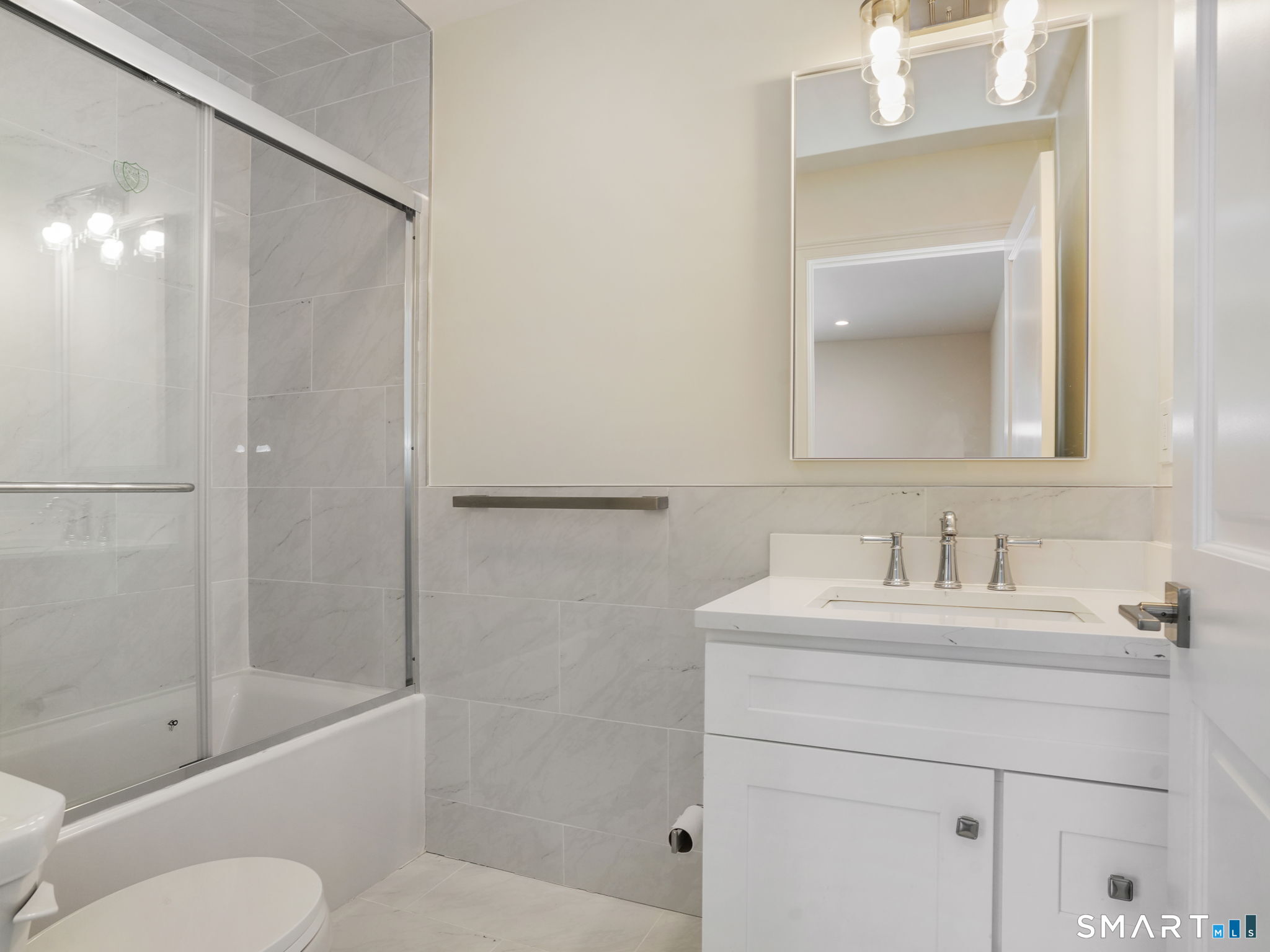 6 Beacon Square, Unit 7 Fairfield, CT 06825 - Photo 28 of 33 a bathroom with a sink toilet and shower