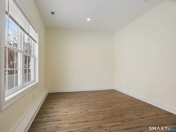 a bathroom with a glass shower door