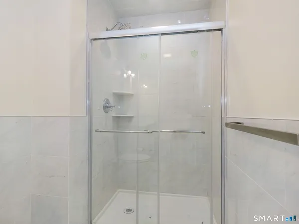 a view of white house with a snow in the yard