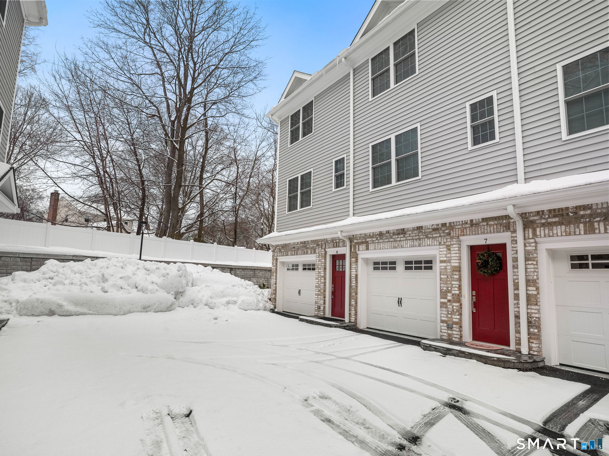 6 Beacon Square, Unit 7 Fairfield, CT 06825 - Photo 31 of 33 a view of white house with a snow in the yard